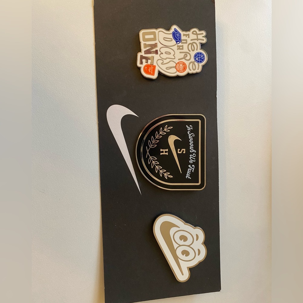 Vintage Nike graduation themed pins.